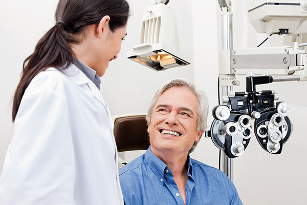 Photograph of optometrist and patient